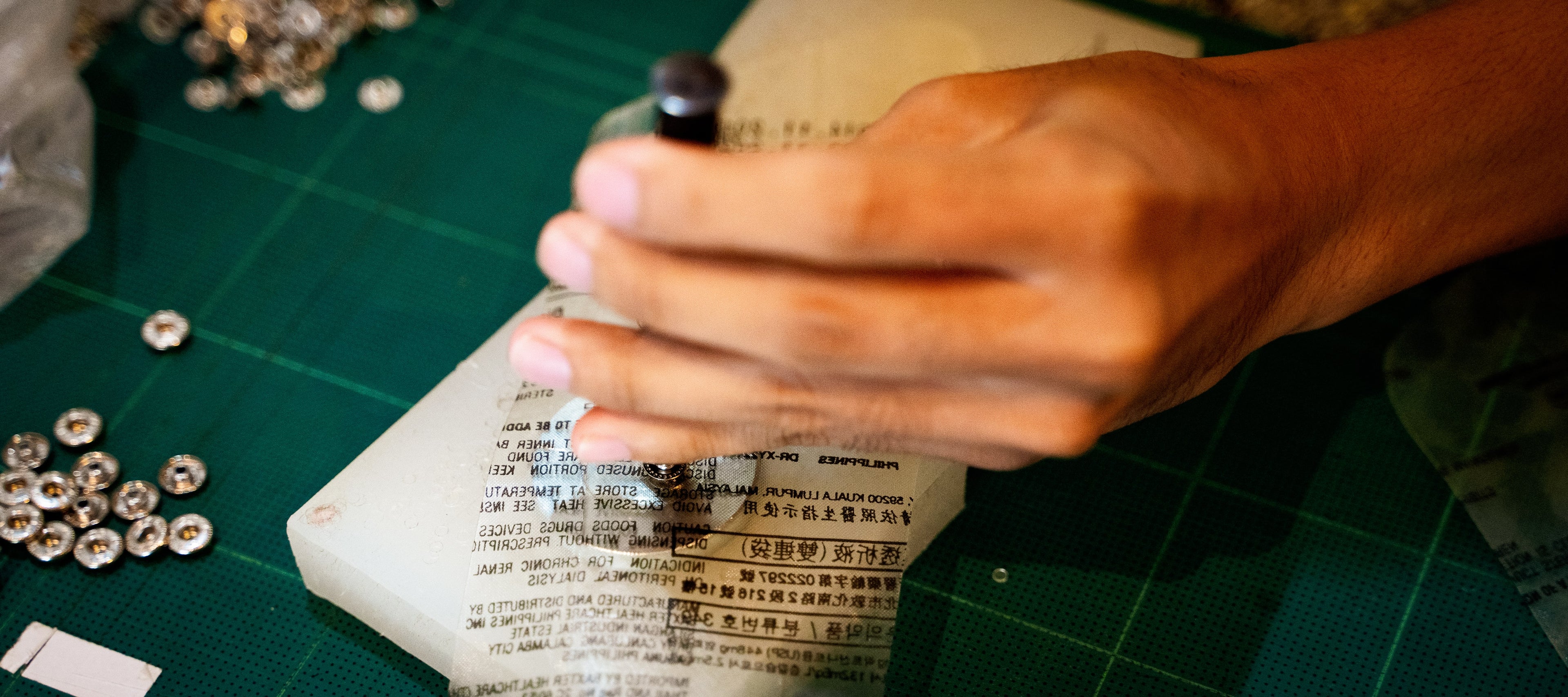 Crafting of the recycled dialysis bags by pop. the crafts are sold on QA