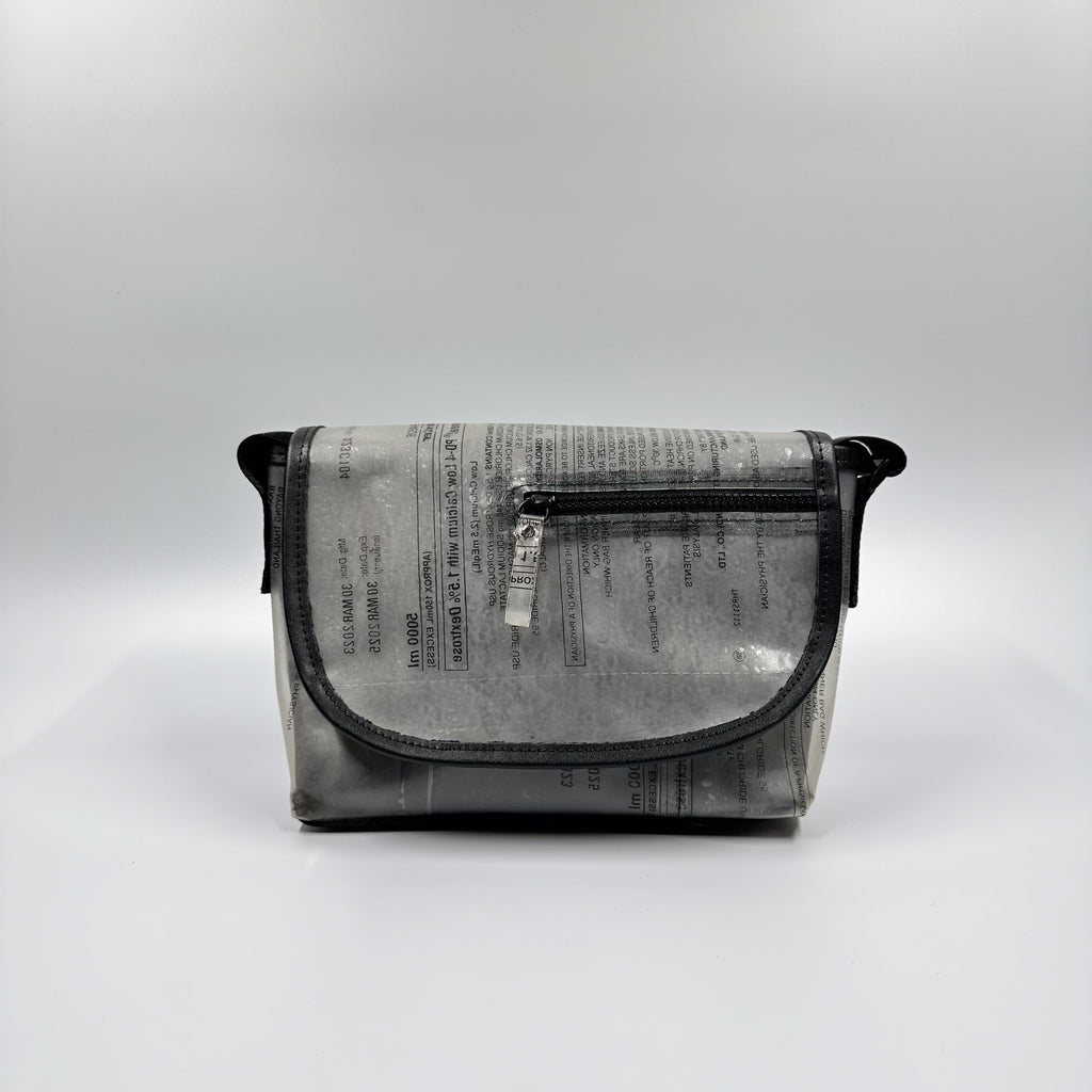 Handicraft sustainable and recycled accessory bag from Asia. The pouch is made of recycled dialysis bag and is sold online on www.qacrafts.com.