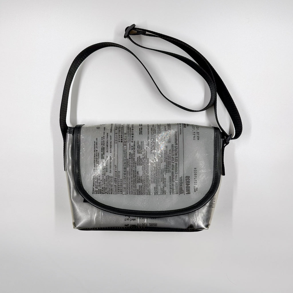 Handicraft sustainable and recycled accessory bag from Asia. The pouch is made of recycled dialysis bag and is sold online on www.qacrafts.com.