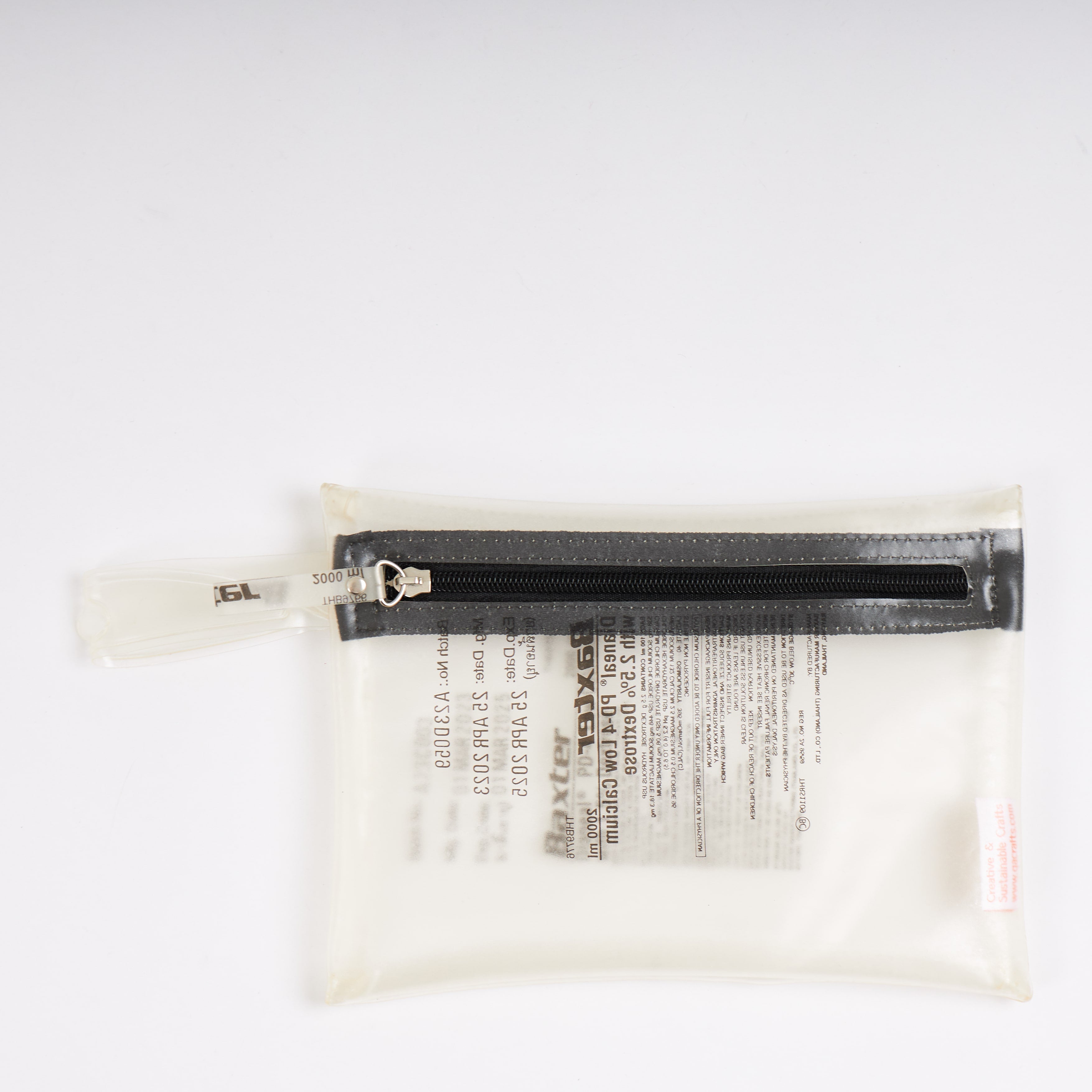 Sustainable handcraft and recycled pouch from Asia. The pouch is made of recycled dialysis bag and is sold online on www.qacrafts.com.