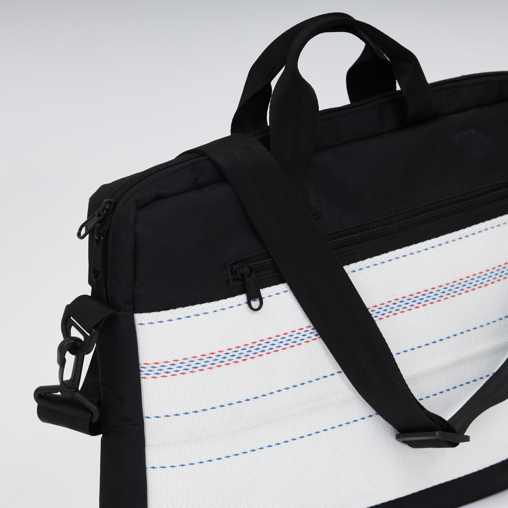 Handmade upcycled firehose bag and laptop bag. Sustainable and eco-friendly, we sell the bag on www.qacrafts.com