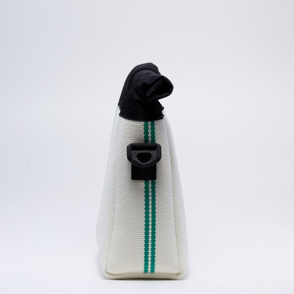 Handicraft sustainable and recycled bag from Asia. The crossbody bag is made of recycled firehose and sold online on www.qacrafts.com. 
